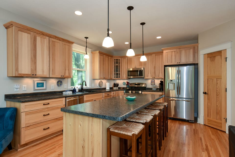 Prepare meals in the roomy,  well-equipped kitchen with island.