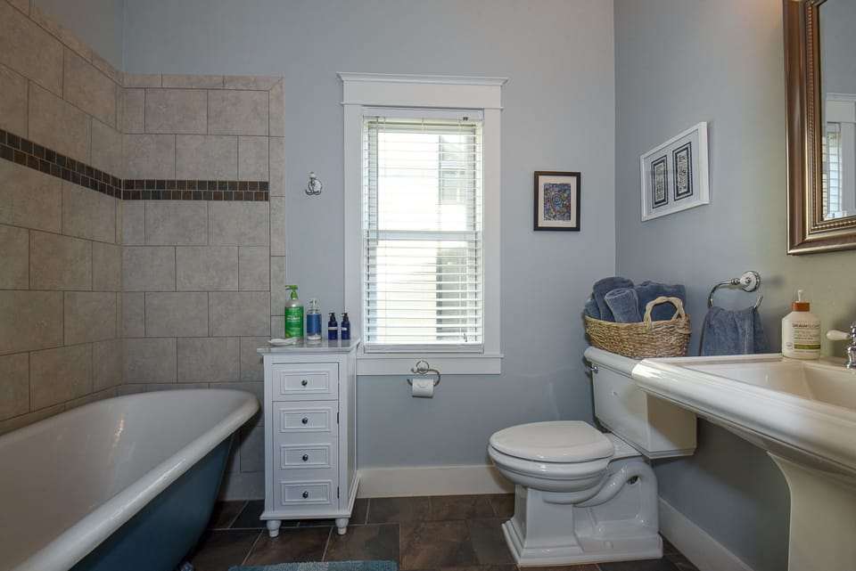 Full bath with clawfoot tub on main floor.