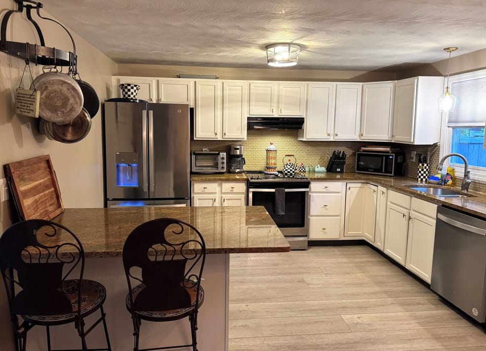 Eat in kitchen. Table seats 8. Island seats 2.