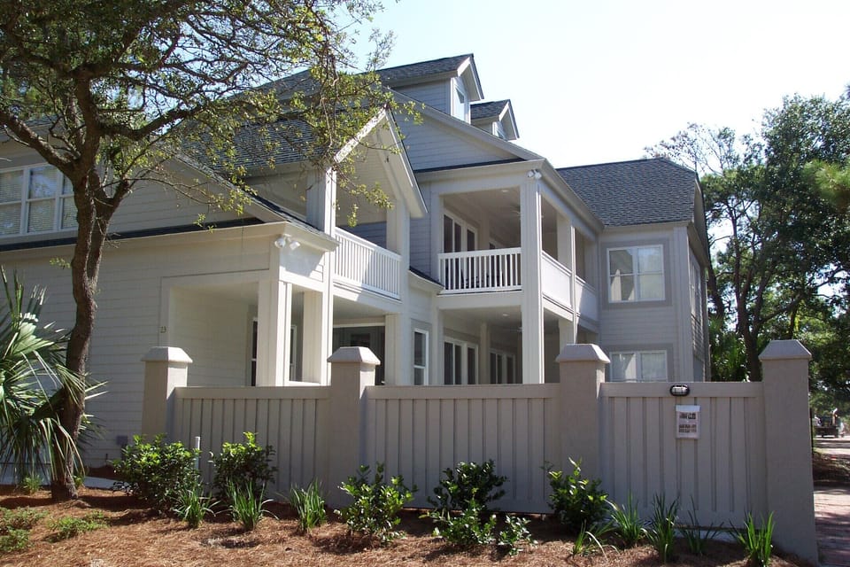 A fence surrounds the pool and offers privacy on the deck and patio.
