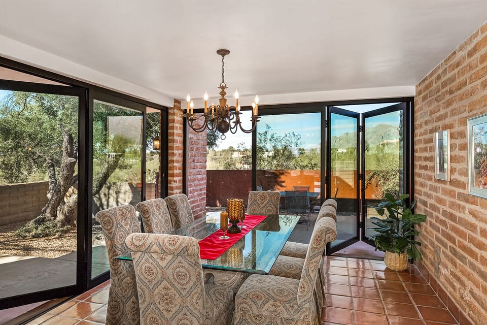 Dining with 2 walls of retractable glass doors!