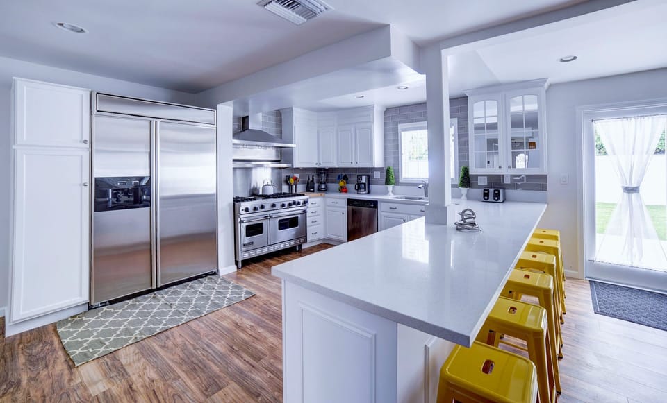 Eat-at bar for 6.  Kitchen is fully stocked with small appliances & dishware.