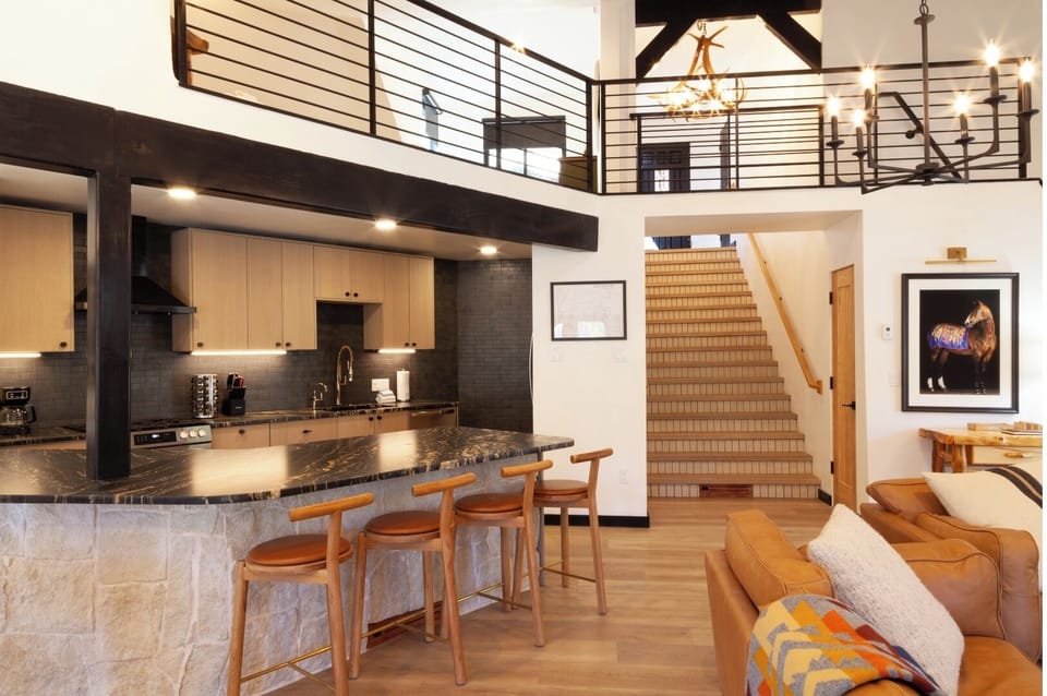 Unwind in your open-concept living space with soaring ceilings, stylish modern finishes, and a fully-equipped chef's kitchen perfect for gathering with loved ones.