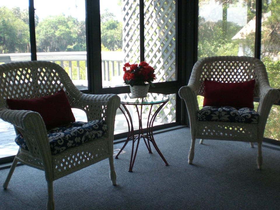 Sun Room opens to upper deck and over looks lagoon & golf course.