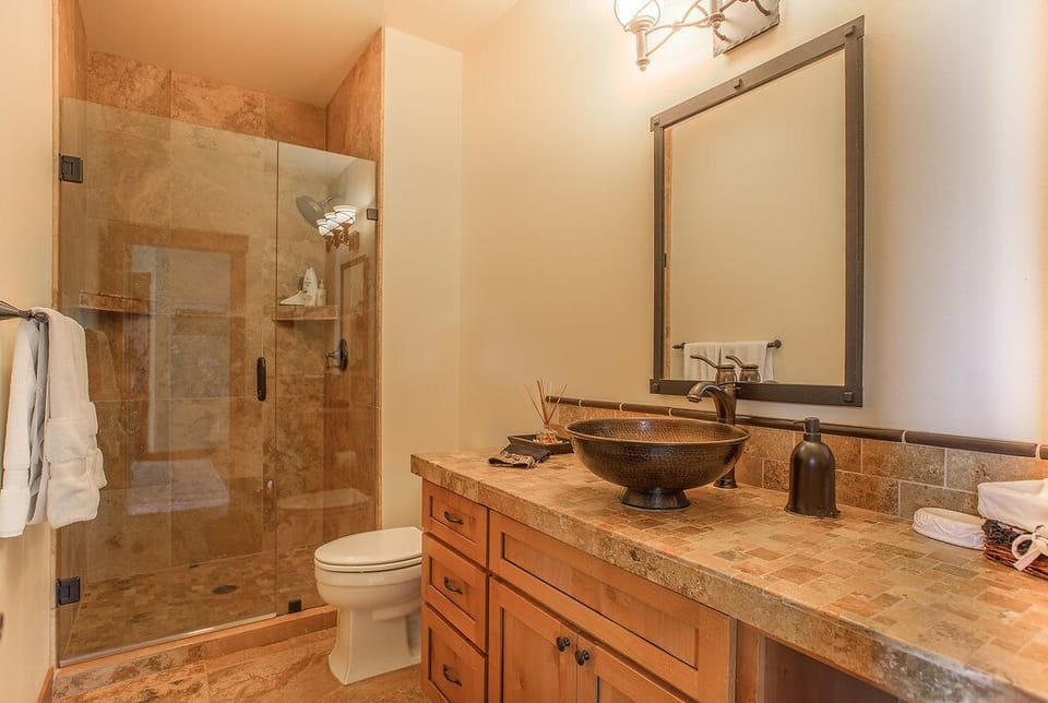 Main floor bath with Italian  tile walk in shower,copper sink