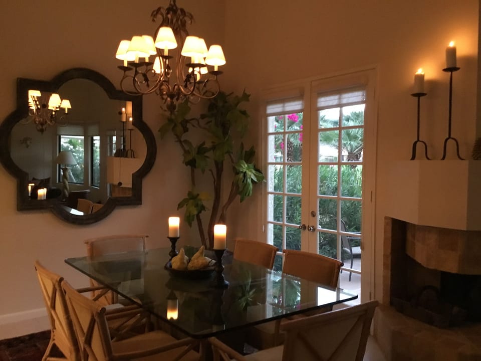Dining Room seats six. Fireplace and access to DR patio table and grill.