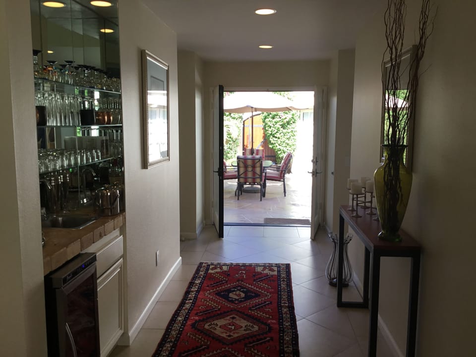 From living room looking into foyer and main entry/courtyard.