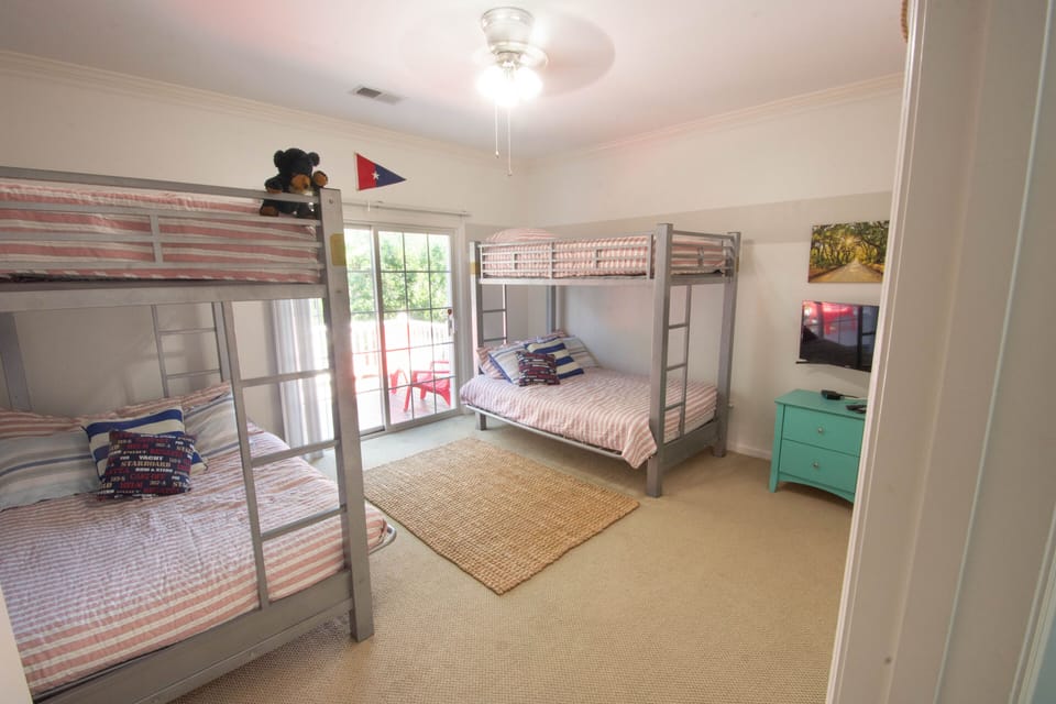 Bunk Room with TV. Two doubles on the bottom and singles on the top.  Sleeps 6. 