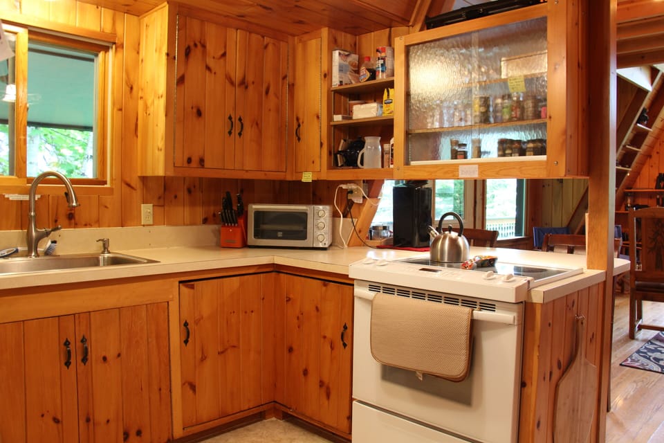 Stocked kitchen including a variety of spices.