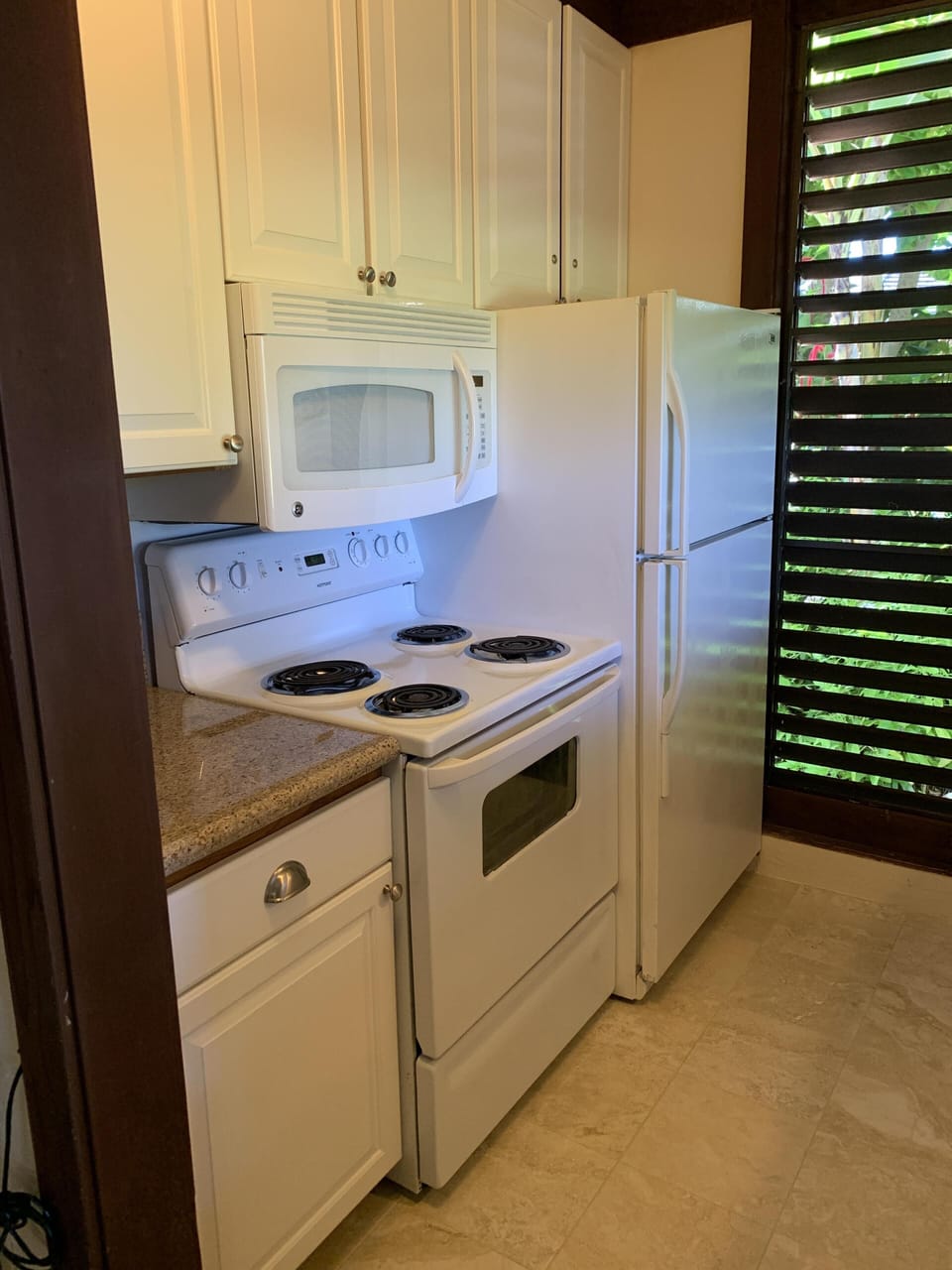 The kitchen has full sized appliances.