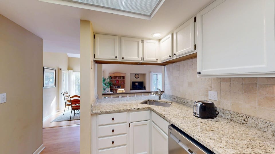 Kitchen sink and pass-through to living area