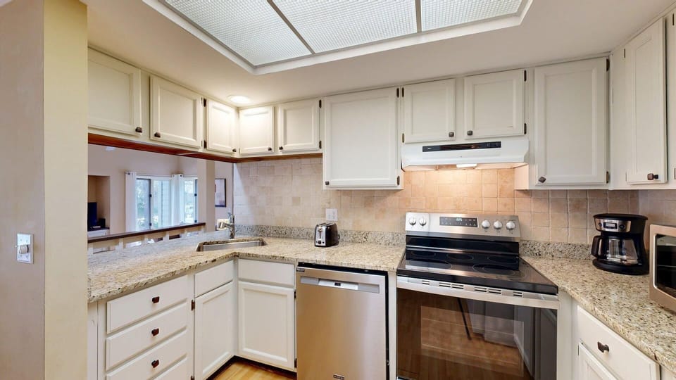 Kitchen with granite counter tops and new stainless appliances