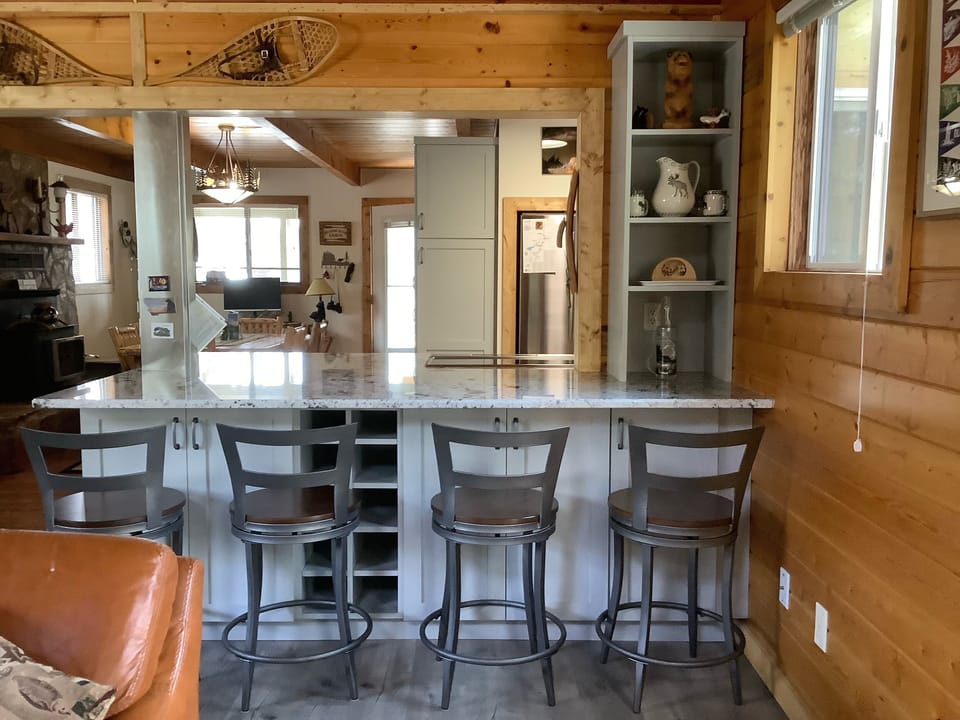 Additional seating for 4 guests, cards & games stored in bottom cabinet to right