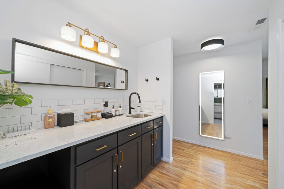 Convenient kitchenette with sink, mini fridge, and essentials—perfect for morning coffee or quick snacks.