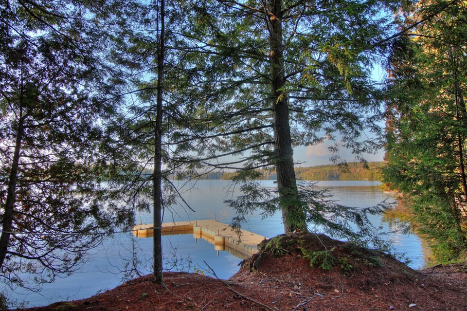 Dock great for swimming, boats, and roped swim area. Sandy bottom, gradual depth