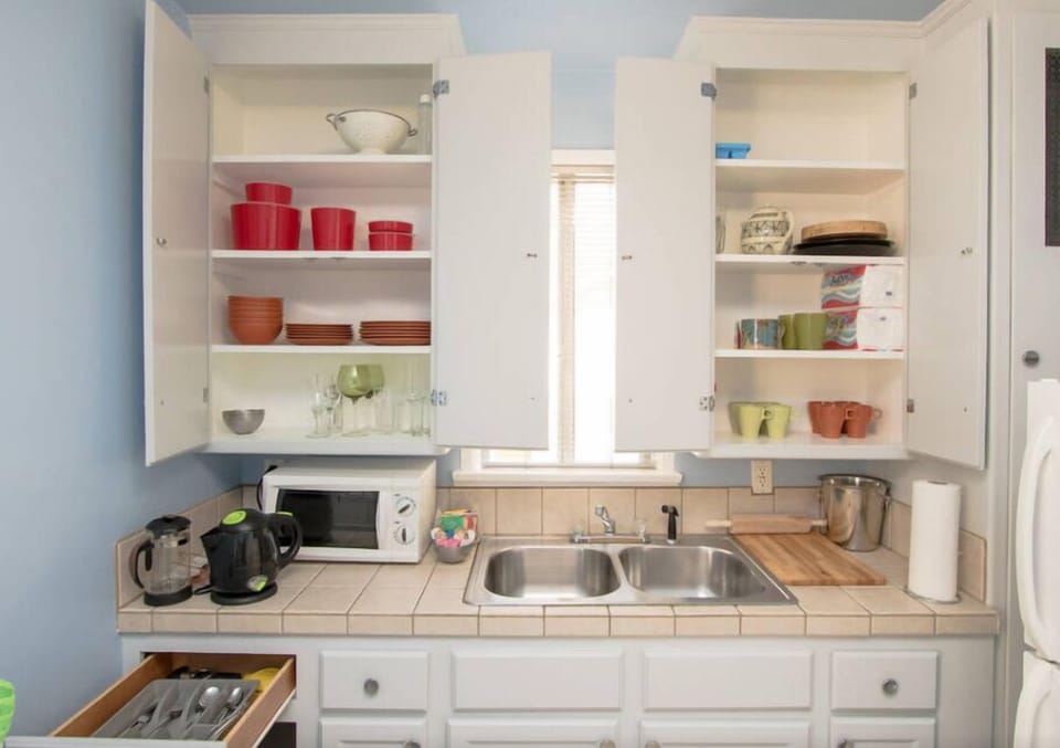An all-in-one kitchen! Coffee, tea, ice bucket, microwave, cutting board...