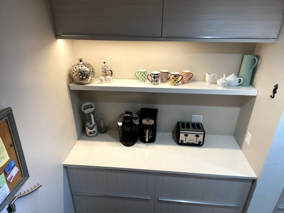Butler pantry off kitchen with coffee makers, Ninja blender, crockpot, etc. 
