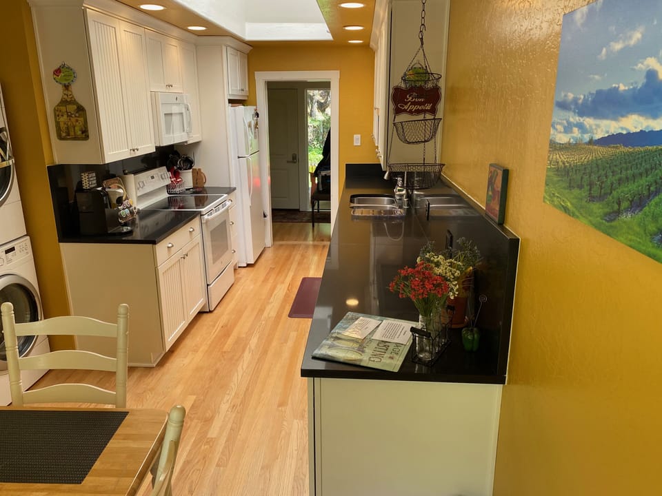 View of kitchen. Clean, bright with overhead skylight