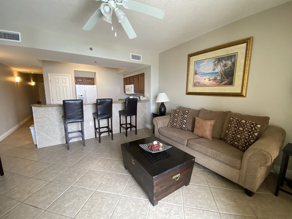 Kick back and relax in our open living area with balcony access and TV!