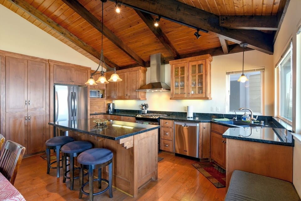 Enjoy bar stools at the kitchen counter while watching the master chef prepare dinner