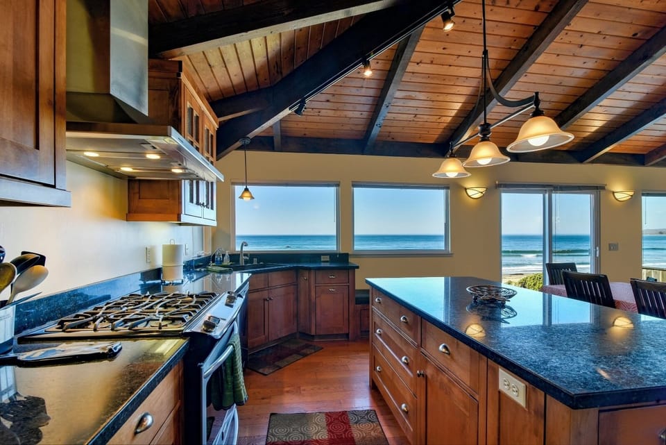The kitchen has granite countertops, lots of space to move around and great views. 
