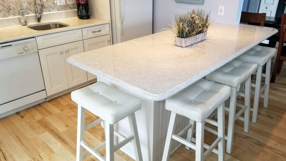 Four stools around the island.