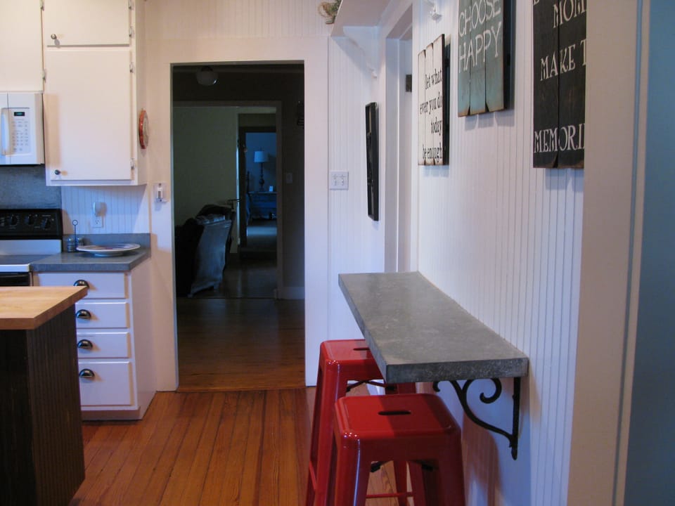 kitchen doorway shows leading into den and master.
