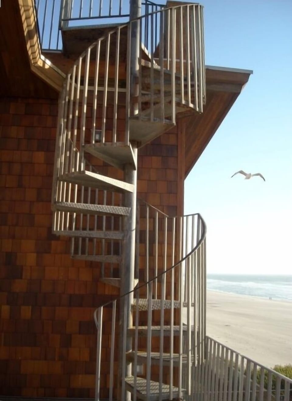 Spiral staircase to roof top deck.