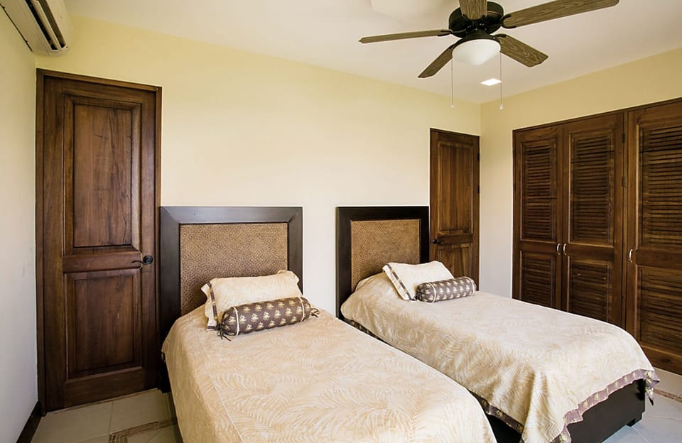Twin beds in the other bedroom suite.  AC in all rooms.