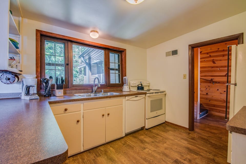 Kitchen with view out to woods