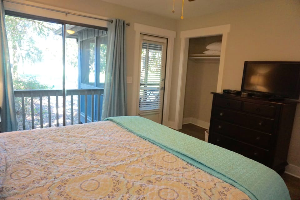 Relax with king bed, large dresser and flat screen TV,  connected to porch