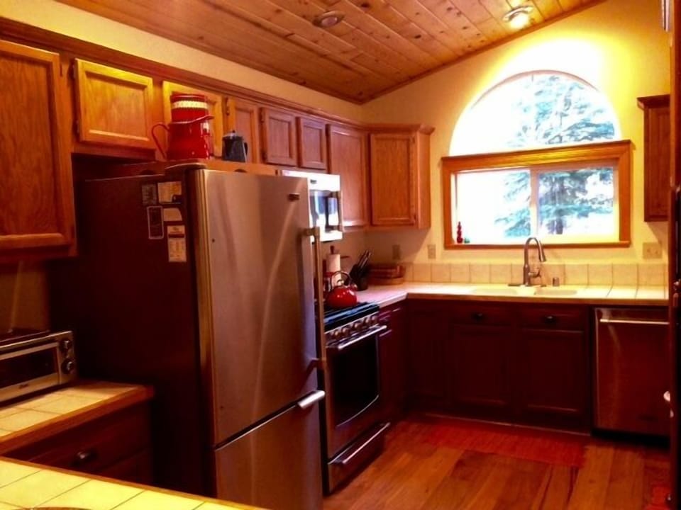 Brand new kitchen appliances and gorgeous contemporary wood floors.