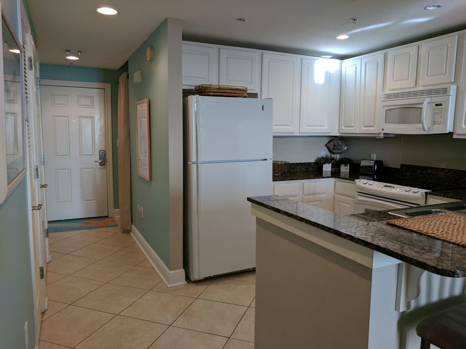 Hallway leading to entrance; bunks to right, bath and laundry to left.