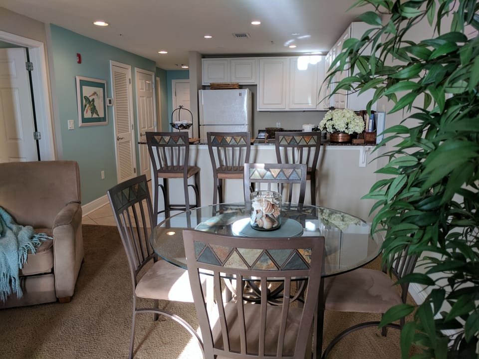 Dining area looking back toward breakfast bar and kitchen.