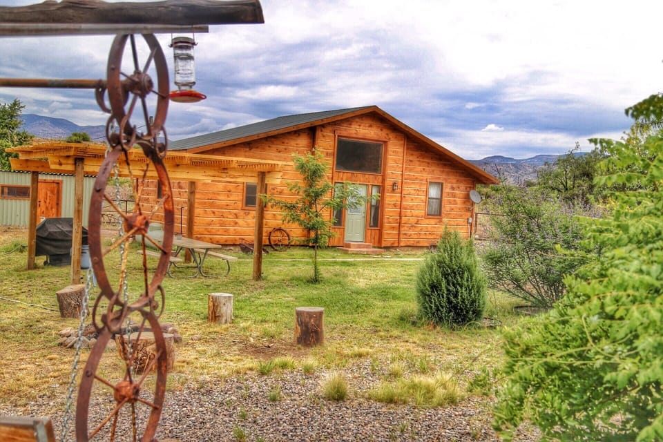 Pergola with gas grill and picnic table, firepit and swing
