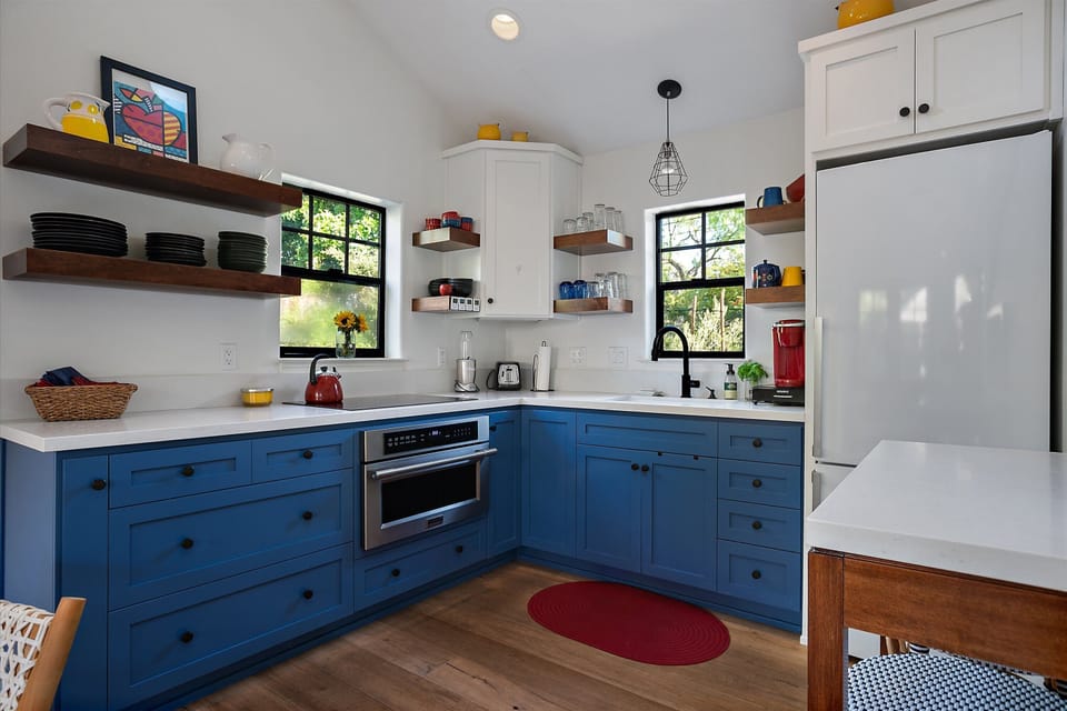Kitchen. Full refrigerator.  4 burner induction cook-top.  Combo microwave/oven.