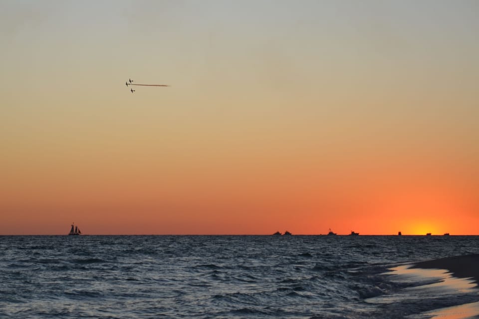 Air show and boats at Sunset from our beach.