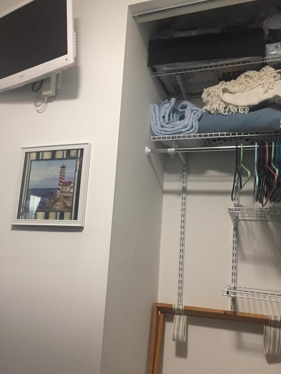 closet system in bunk bedroom.  room for storage and suitcases. Flat Screen TV