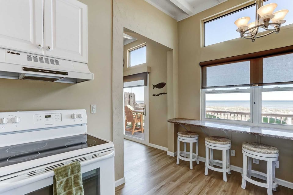 Breakfast bar adjacent to kitchen