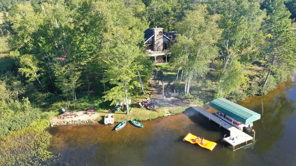 Gresham Retreat sits on a private peninsula with a waterfront gathering space