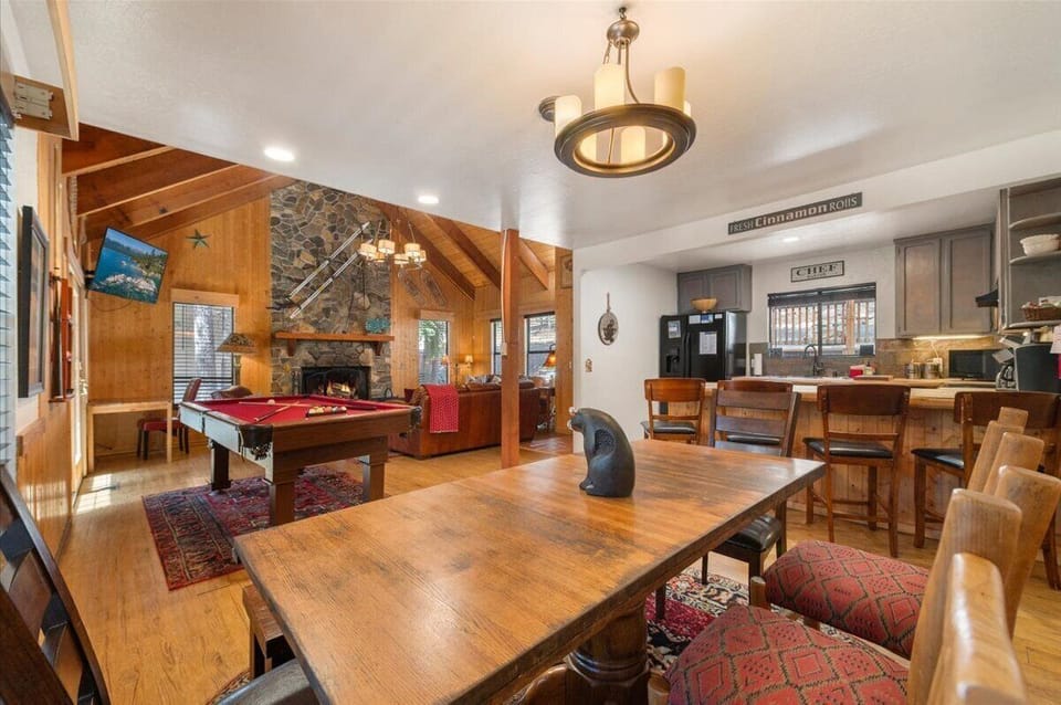 Dining table that faces the kitchen and living area