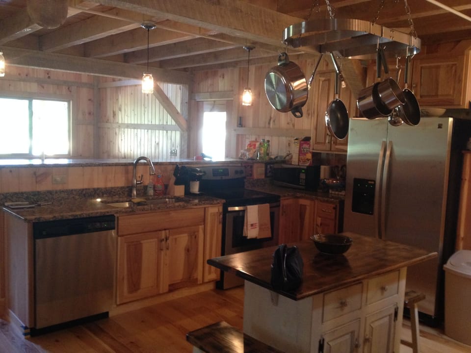 Modern kitchen with new appliances and granite countertops