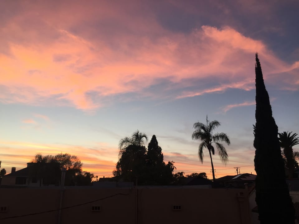 View of sunset from apartment porch