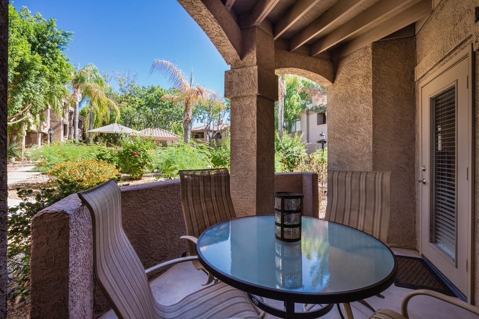 Patio overlooking quiet, secondary pool and grilling area.