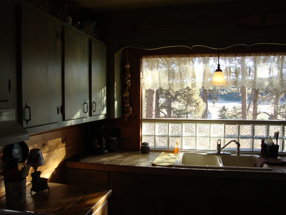 kitchen with huge window above sink, ample work space, fully furnished