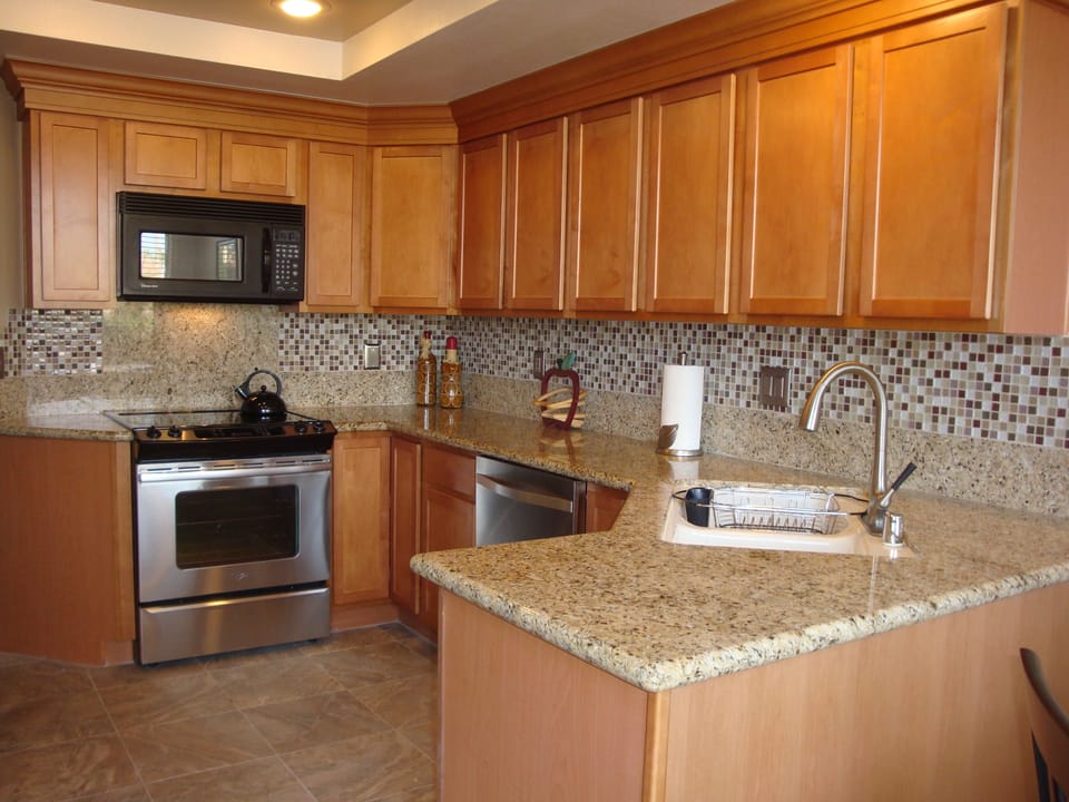 Upgraded kitchen with new stainless steel appliances. 
