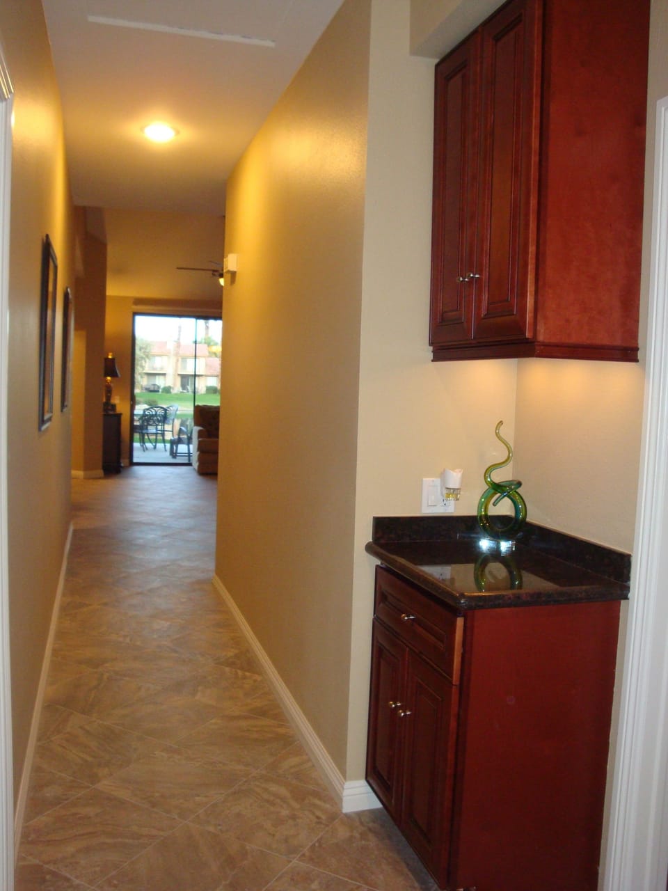 Hallway with convenient linen cabinets.