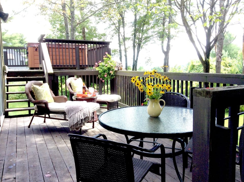 Back Deck overlooking landscaped yard and ski hill