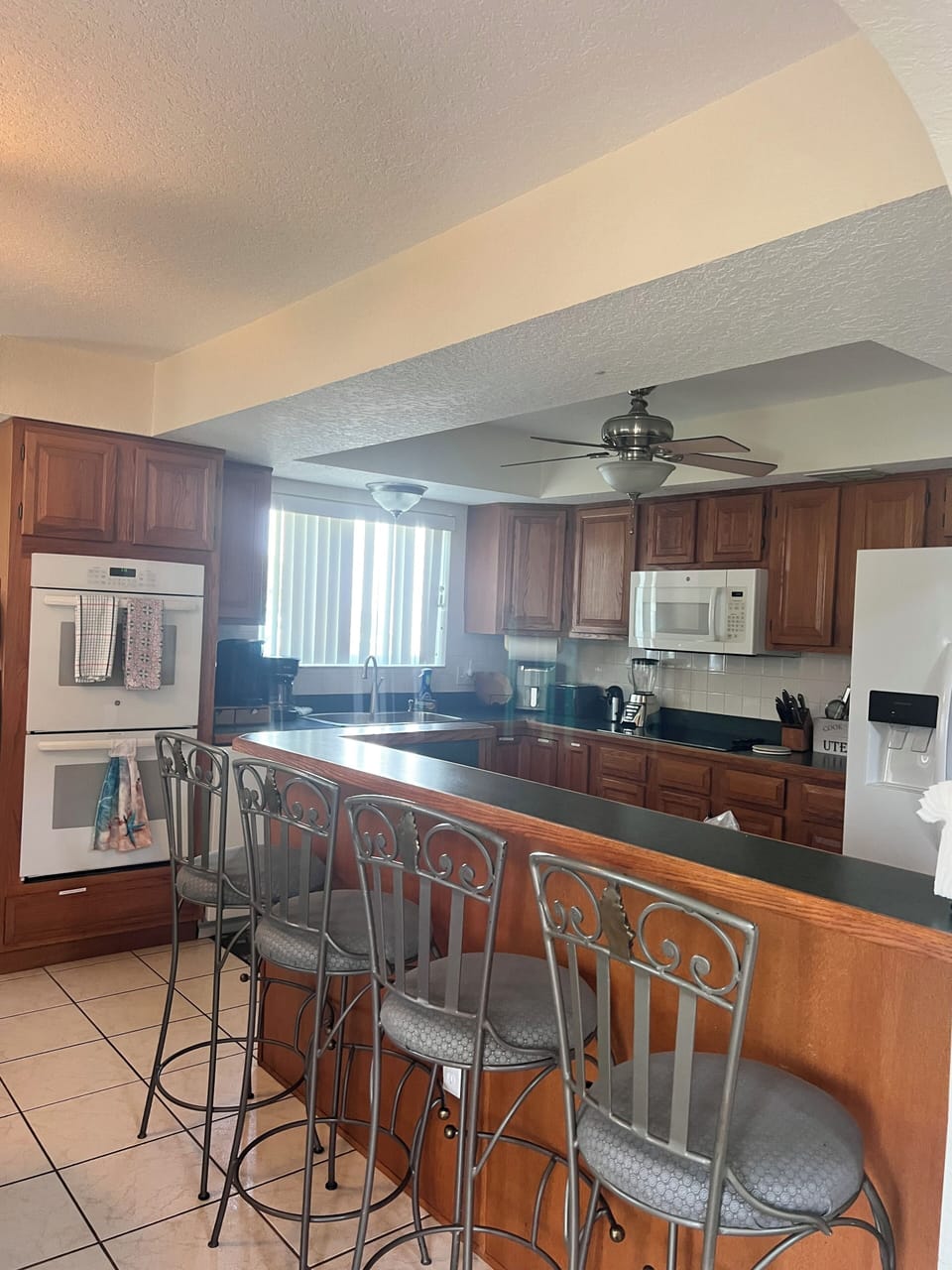 Kitchen view with 4 stools