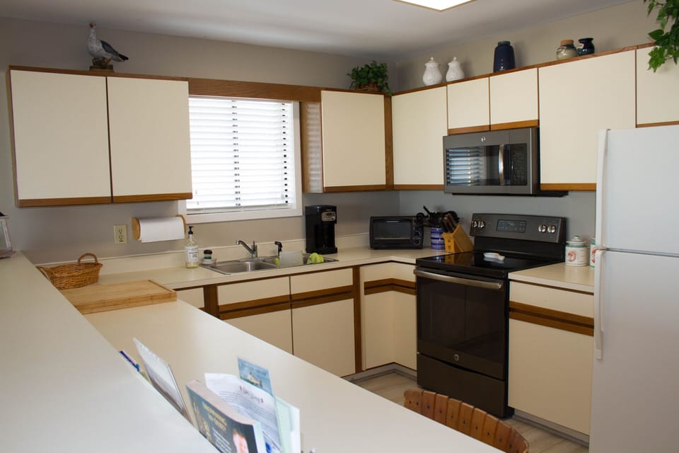 Kitchen with stove, microwave, refrigerator and dishwasher